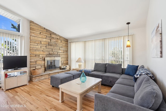 1316 Ocean Ave, Point Pleasant Beach, NJ 08742 - living area featuring light wood-style flooring, vaulted ceiling, and a fireplace