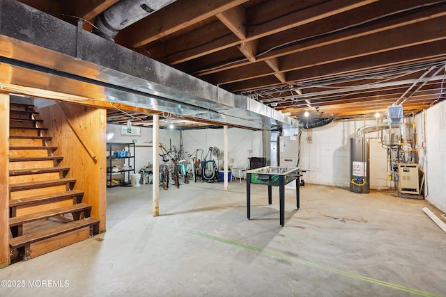 1316 Ocean Ave, Point Pleasant Beach, NJ 08742 - unfinished below grade area with gas water heater, a heating unit, stairway, and heating unit