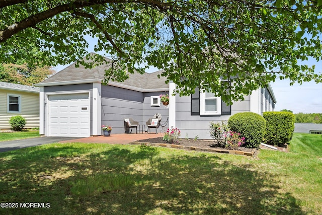 39 Patmore Rd, Brick, NJ 08724 - obstructed view of property with a garage, a front lawn, asphalt driveway, and roof with shingles