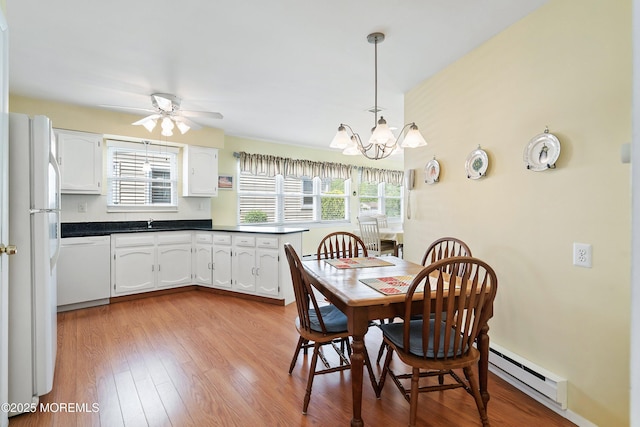 39 Patmore Rd, Brick, NJ 08724 - dining area featuring a baseboard heating unit, a chandelier, light wood-style floors, and ceiling fan