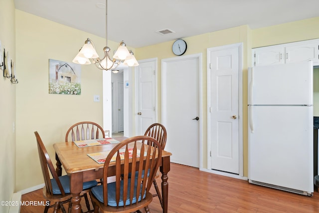 39 Patmore Rd, Brick, NJ 08724 - dining area featuring a chandelier and light wood-style floors