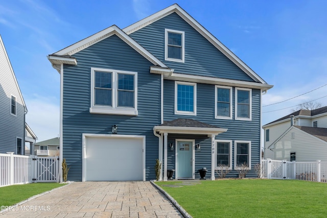 1709 Certainty Dr, Point Pleasant, NJ 08742 - traditional-style home featuring a gate, an attached garage, and decorative driveway