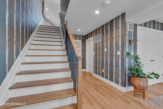 1709 Certainty Dr, Point Pleasant, NJ 08742 - stairway featuring wood finished floors, wallpapered walls, and recessed lighting
