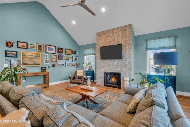 1709 Certainty Dr, Point Pleasant, NJ 08742 - living area with baseboards, high vaulted ceiling, ceiling fan, wood finished floors, and a large fireplace