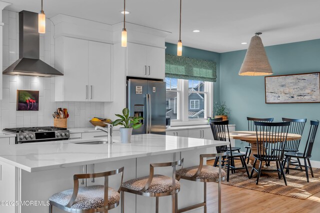 1709 Certainty Dr, Point Pleasant, NJ 08742 - kitchen with stainless steel refrigerator with ice dispenser, wall chimney range hood, a sink, range, and backsplash