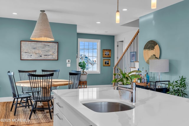 1709 Certainty Dr, Point Pleasant, NJ 08742 - kitchen with light wood finished floors, pendant lighting, recessed lighting, light countertops, and a sink