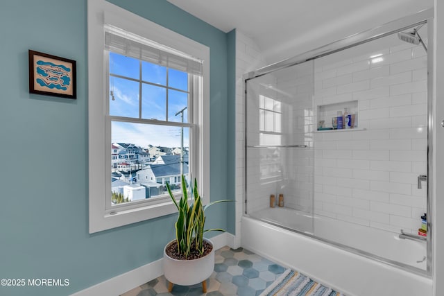 1709 Certainty Dr, Point Pleasant, NJ 08742 - bathroom with healthy amount of natural light, baseboards, and bath / shower combo with glass door