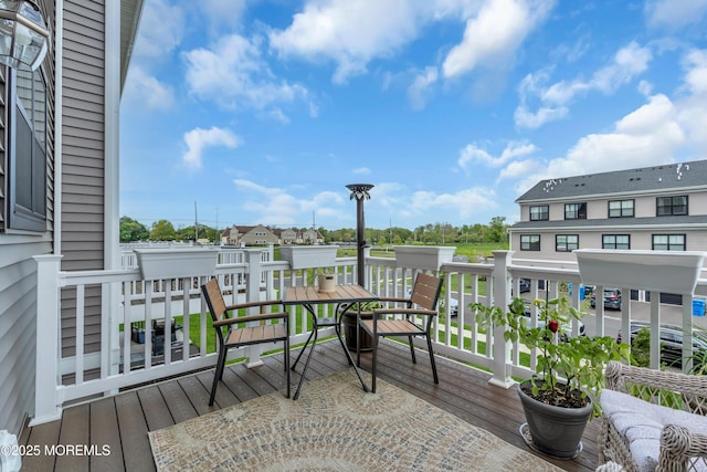 wooden deck featuring a residential view
