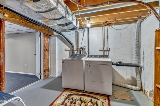 washroom featuring washer and clothes dryer