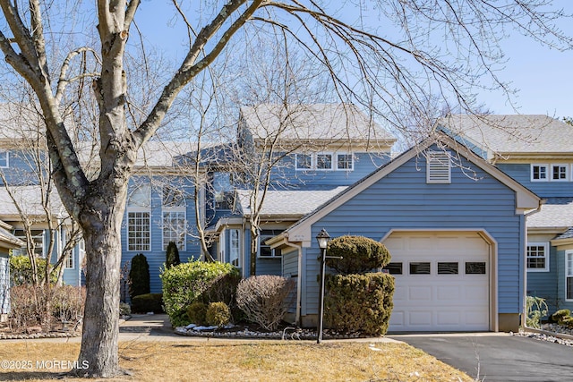 36C Canterbury Dr, Monroe, NJ 08831 - view of front facade featuring a garage, asphalt driveway, and roof with shingles