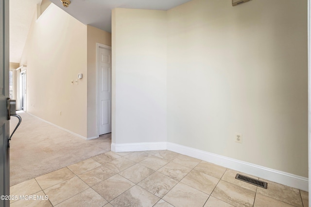 36C Canterbury Dr, Monroe, NJ 08831 - empty room featuring light carpet, baseboards, and light tile patterned floors