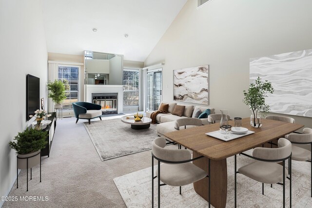36C Canterbury Dr, Monroe, NJ 08831 - dining space featuring high vaulted ceiling, light carpet, plenty of natural light, and a glass covered fireplace