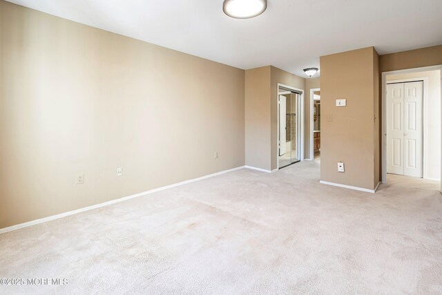 36C Canterbury Dr, Monroe, NJ 08831 - empty room with light carpet and baseboards