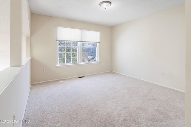 36C Canterbury Dr, Monroe, NJ 08831 - carpeted spare room with baseboards