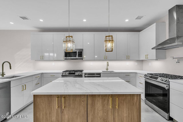 14 Blue River Way, Lakewood, NJ 08701 - kitchen with stainless steel appliances, wall chimney exhaust hood, a sink, white cabinets, and recessed lighting