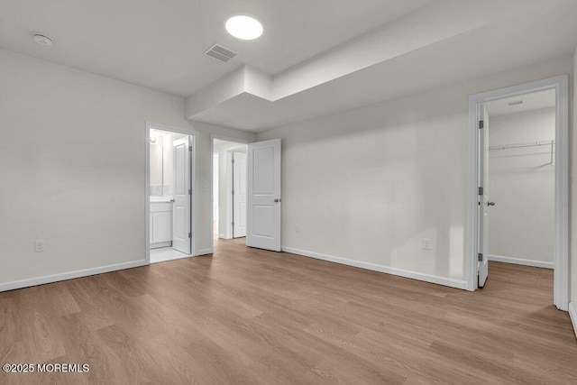 14 Blue River Way, Lakewood, NJ 08701 - unfurnished bedroom featuring wood finished floors, baseboards, and a spacious closet