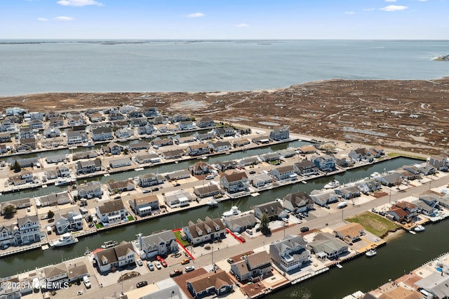 aerial overview of property's location with nearby suburban area and a large body of water