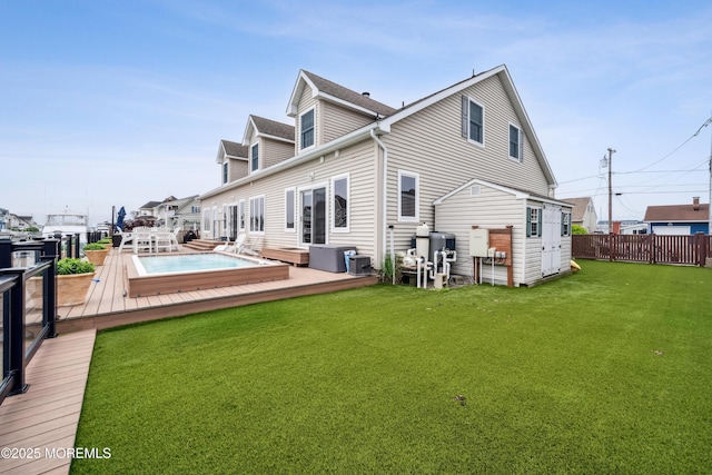 rear view of property featuring a wooden deck