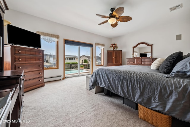 bedroom featuring baseboard heating, access to outside, light colored carpet, and ceiling fan
