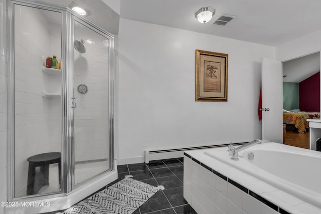 ensuite bathroom with a stall shower, a garden tub, tile patterned floors, and a baseboard heating unit