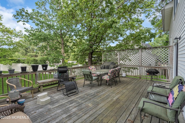 deck with outdoor dining space