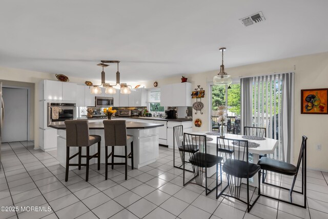 dining room with light tile patterned floors