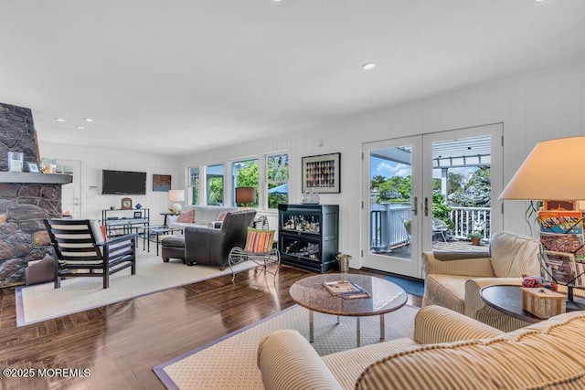 7 Sunset Dr, Asbury Park, NJ 07712 - living area featuring a fireplace, french doors, wood finished floors, and recessed lighting