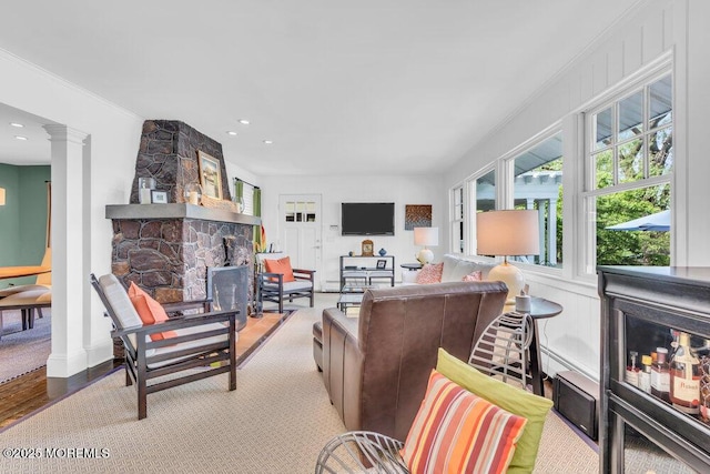 7 Sunset Dr, Asbury Park, NJ 07712 - living area with a stone fireplace, decorative columns, recessed lighting, ornamental molding, and wood finished floors