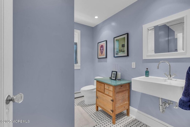 7 Sunset Dr, Asbury Park, NJ 07712 - bathroom featuring baseboards, baseboard heating, and toilet