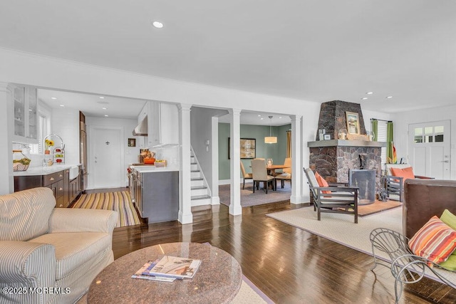 7 Sunset Dr, Asbury Park, NJ 07712 - living room featuring decorative columns, wood finished floors, stairs, and recessed lighting