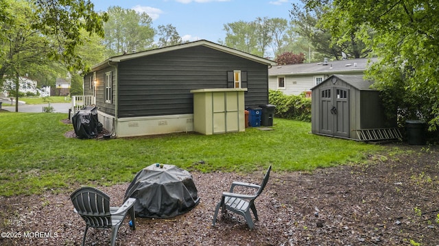 15 Cedar Ct, Manalapan, NJ 07726 - back of property with a storage unit, crawl space, a lawn, and an outbuilding