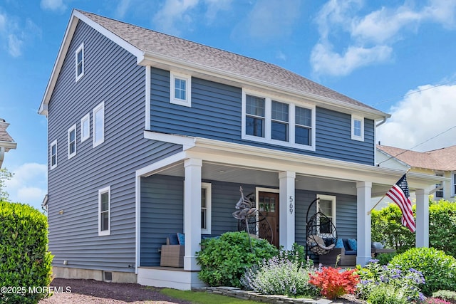 view of front of property featuring covered porch