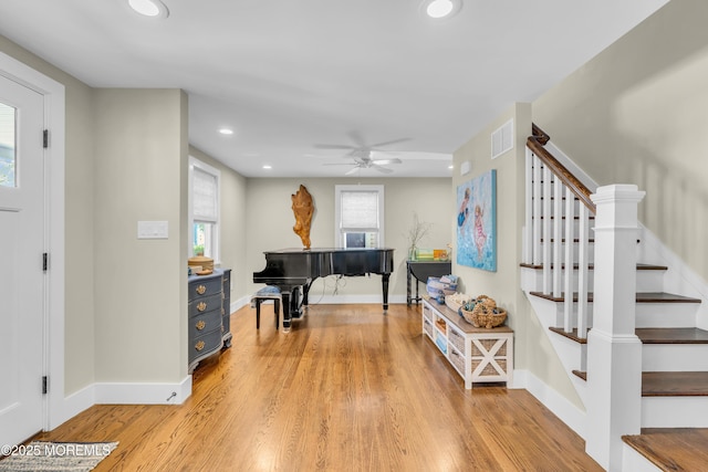 entryway with baseboards, stairs, light wood-style flooring, a ceiling fan, and recessed lighting