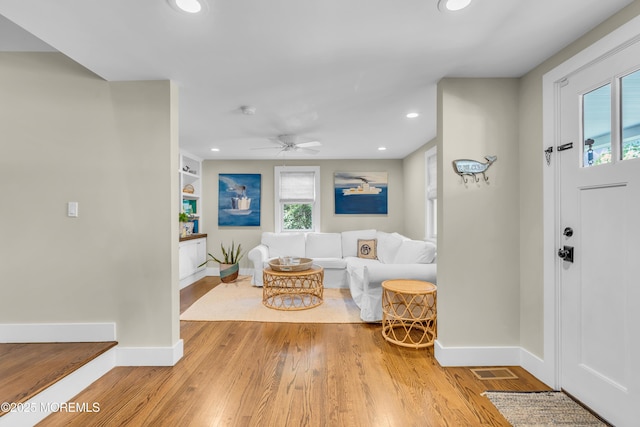 foyer entrance with baseboards, wood finished floors, recessed lighting, and ceiling fan