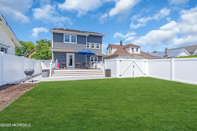 back of house with a gate and a wooden deck