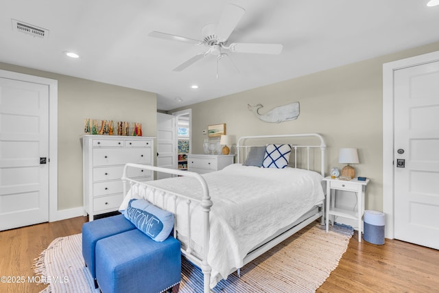 bedroom featuring wood finished floors, recessed lighting, and ceiling fan