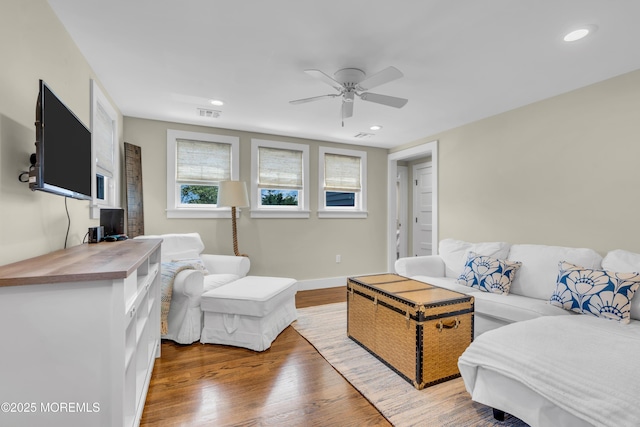living area with ceiling fan, wood finished floors, recessed lighting, and baseboards