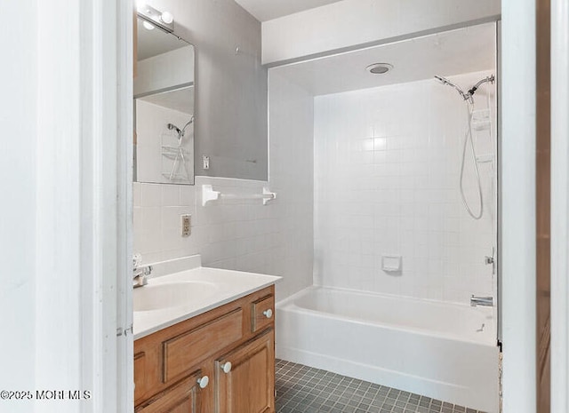 14 E Ave, Atlantic Highlands, NJ 07716 - bathroom featuring vanity, tile patterned flooring, bathing tub / shower combination, and tile walls