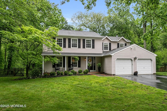 view of front of property featuring a garage, asphalt driveway, a porch, and a shingled roof