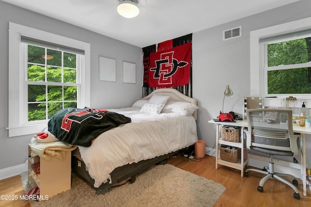 bedroom with wood finished floors