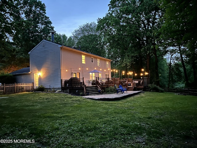 back of house with a wooden deck