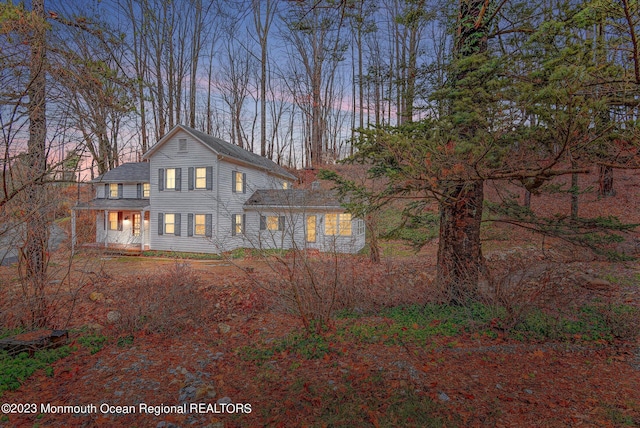 view of front of house with roof with shingles