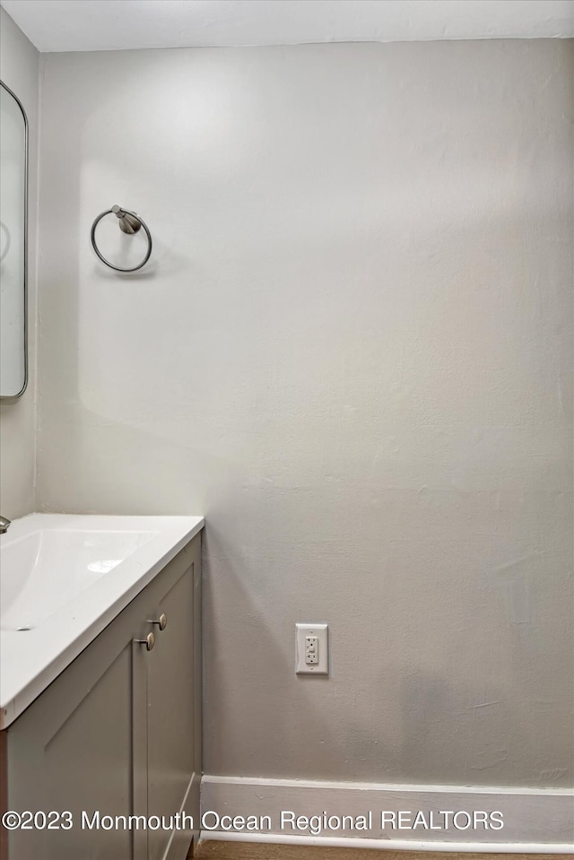 bathroom with vanity and baseboards