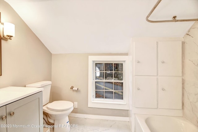 bathroom featuring marble finish flooring, vanity, toilet, baseboards, and shower / washtub combination