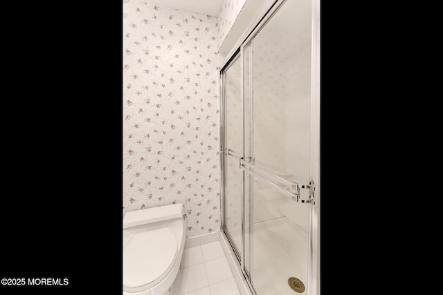 128 Jumping Brook Rd, Lincroft, NJ 07738 - bathroom featuring wallpapered walls, a shower stall, tile patterned flooring, toilet, and baseboards