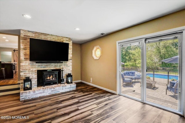 49 Glenbrook Rd, Freehold, NJ 07728 - unfurnished living room featuring wood finished floors, baseboards, recessed lighting, and a fireplace