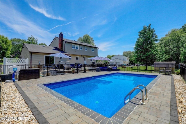 49 Glenbrook Rd, Freehold, NJ 07728 - view of swimming pool featuring a patio area, fence, and a residential view