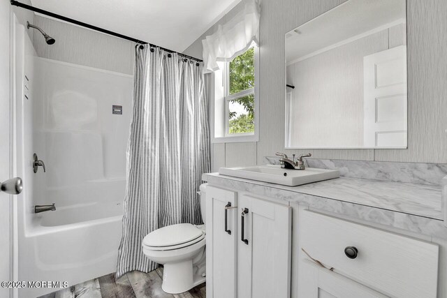 full bathroom with toilet, vanity, shower / tub combo, and crown molding