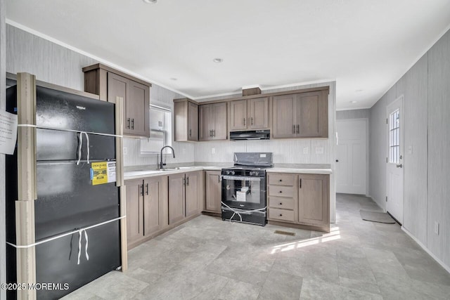 205 Maple St, Robbinsville, NJ 08691 - kitchen with black appliances, under cabinet range hood, light countertops, crown molding, and open shelves