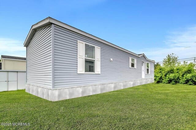 205 Maple St, Robbinsville, NJ 08691 - view of home's exterior featuring a lawn